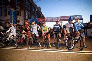Riders are called to the start line for the Sunny King twilight criterium
