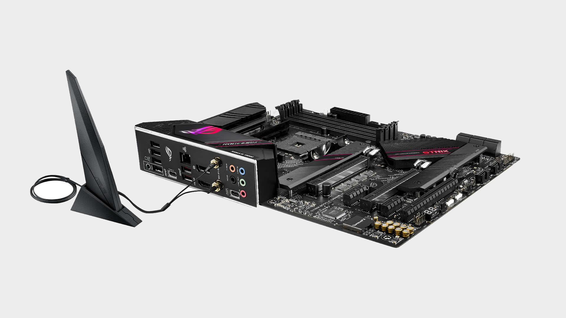 Image of the Asus ROG Strix B550-E Gaming motherboard pictured lying flat on a grey background.