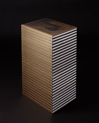 Stack of same design books with brown cover