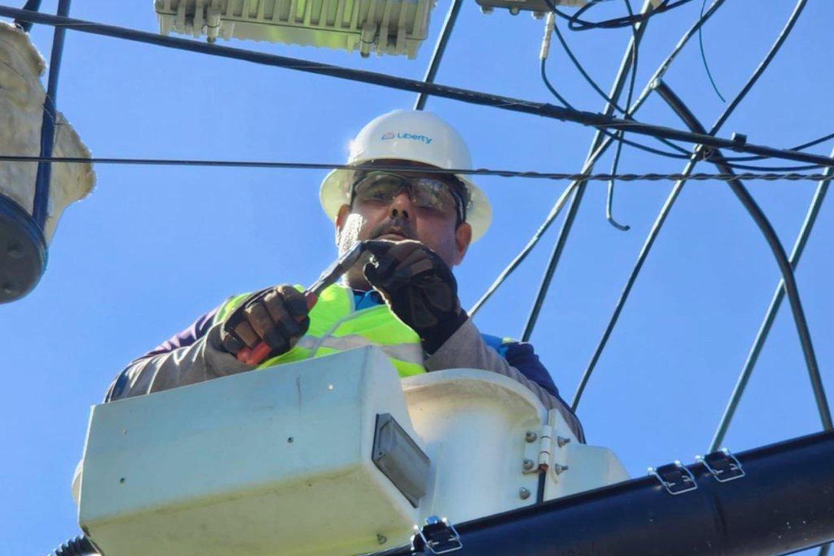 Liberty Latin America image of a man working on a cell tower