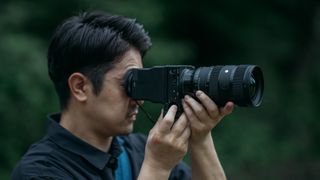 Sigma 28-45mm f/1.8 DG DN lens, mounted to a Sigma fp L camera, being used outdoors by Yuichiro Fujishiro