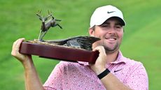 Chris Gotterup poses with the John Deere Classic trophy after his win in 2026