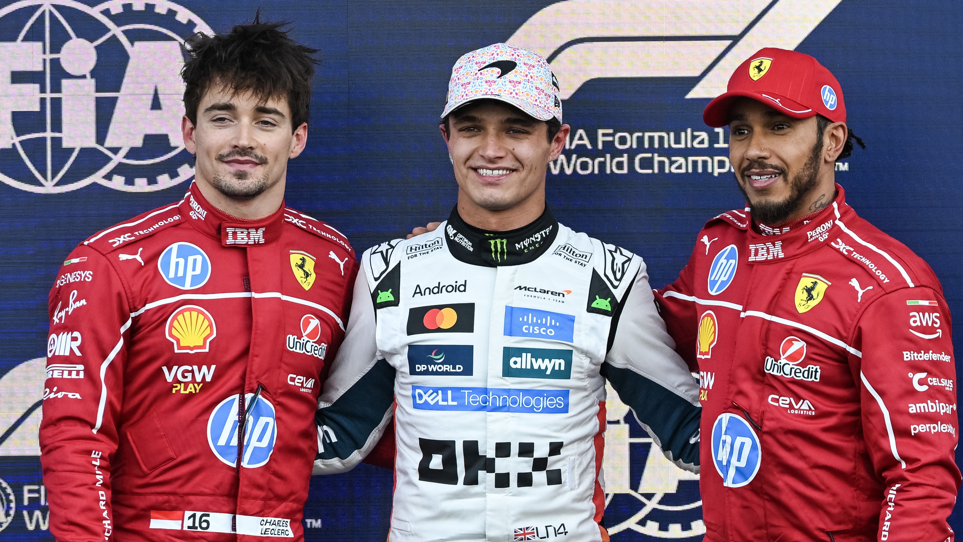 Pole position qualifier Lando Norris of Great Britain and McLaren Second placed qualifier Charles Leclerc of Monaco and Scuderia Ferrari and Third placed qualifier Lewis Hamilton of Great Britain and Scuderia Ferrari in parc ferme during qualifying ahead of the F1 Grand Prix of Mexico at Autodromo Hermanos Rodriguez on October 25, 2025 in Mexico City, Mexico.