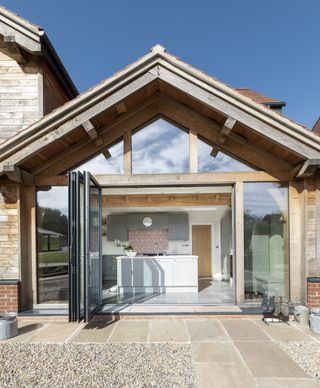 face glazing and bifold doors in oak frame self build kitchen