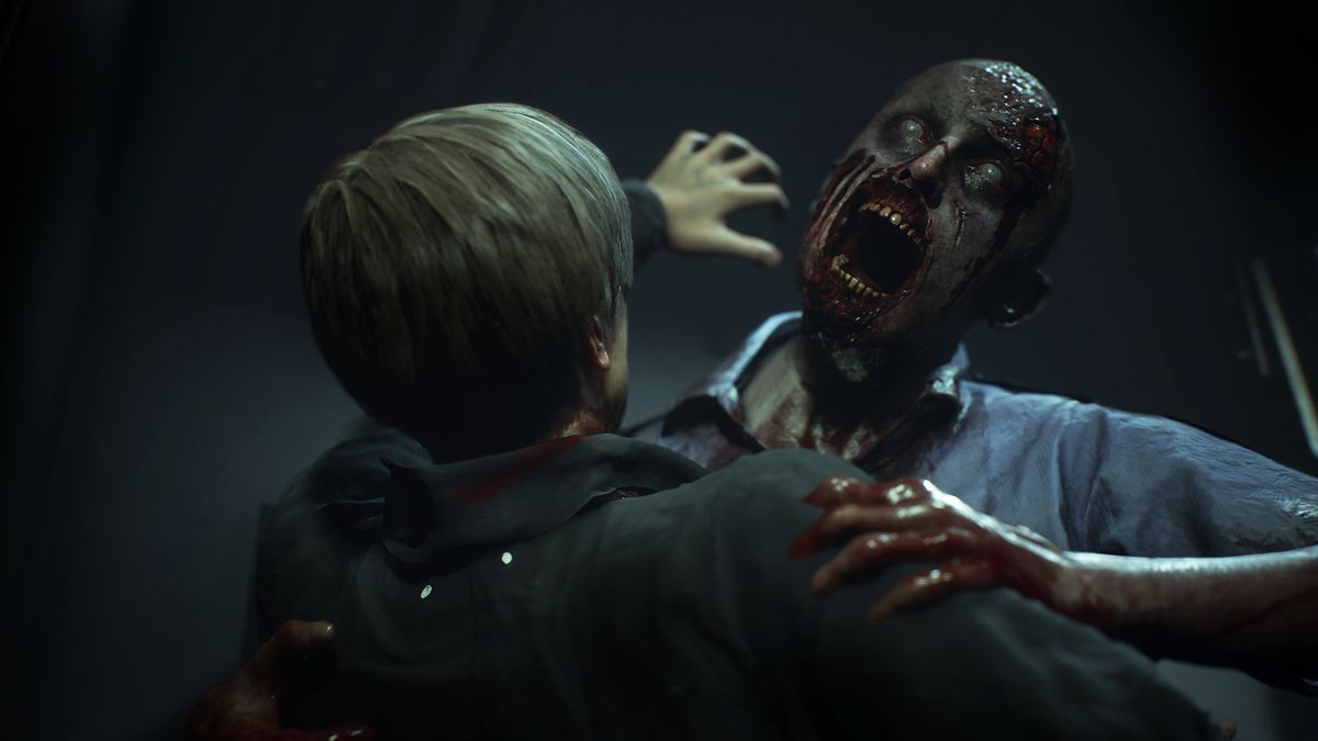 Resident Evil 2 remake screenshot of Leon Kennedy being attacked by a zombie who's trying bite him