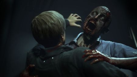 Resident Evil 2 remake screenshot of Leon Kennedy being attacked by a zombie who's trying bite him