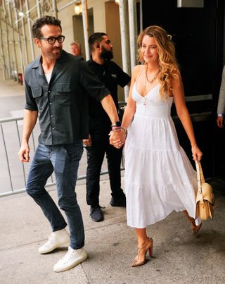 Ryan Reynolds and Blake Lively walking together hand in hand