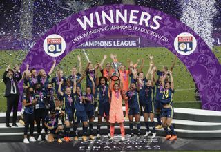 Lyon celebrate with the trophy after winning the Women’s Champions League final for the fifth successive time