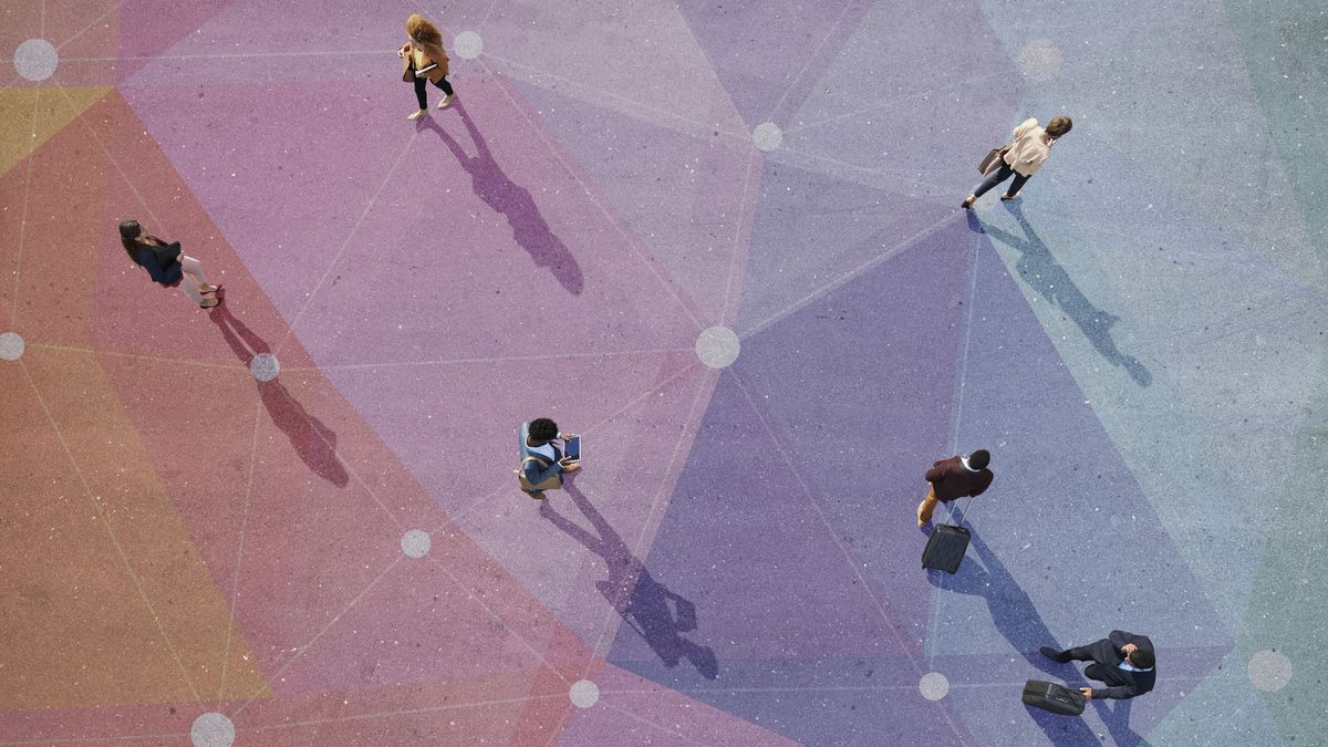 Top view of people walking in different directions of pattern, painted on asphalt as visual representation of network slicing