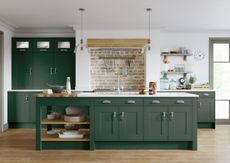 Kitchen with green Shaker style doors and island