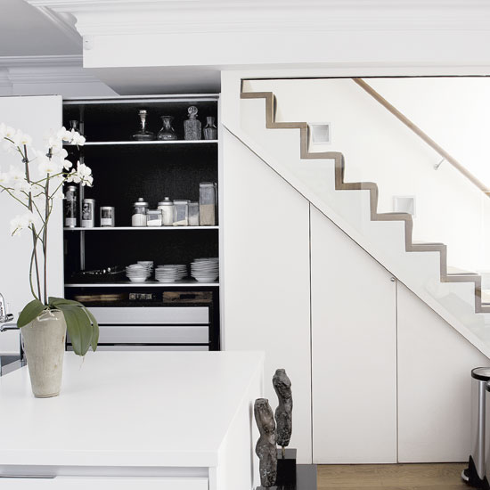 staircase with glass panel flower vase