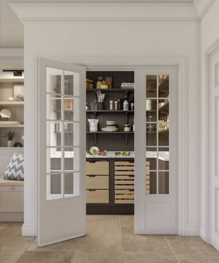 walk in pantry in kitchen with glass panelled doors leading to room with open shelving and drawers below worktop