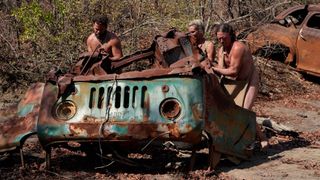 Survivalists scavenge ruins to survive a forbidding wasteland in South Africa in a shot from 'Naked and Afraid: Apocalypse'