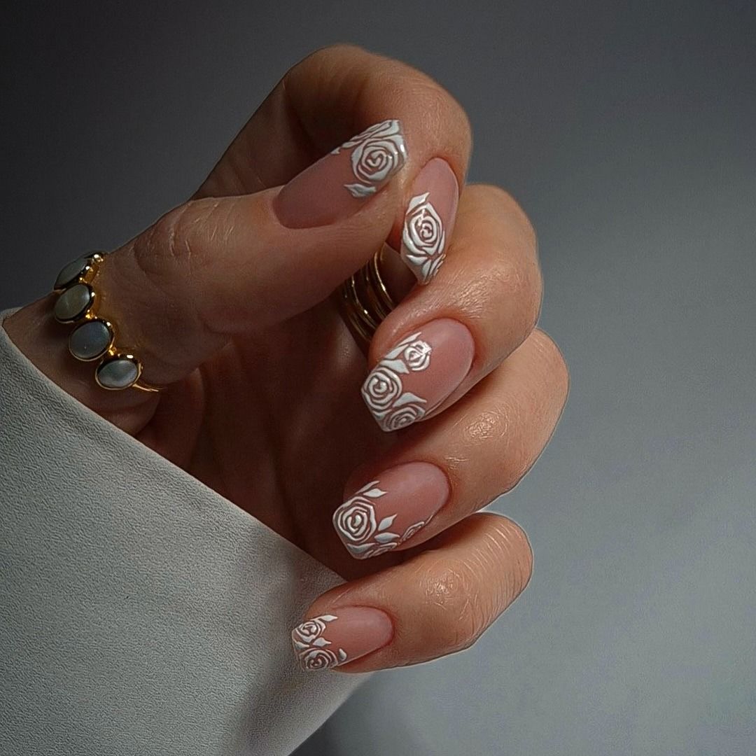 Photo of a white lace nail look