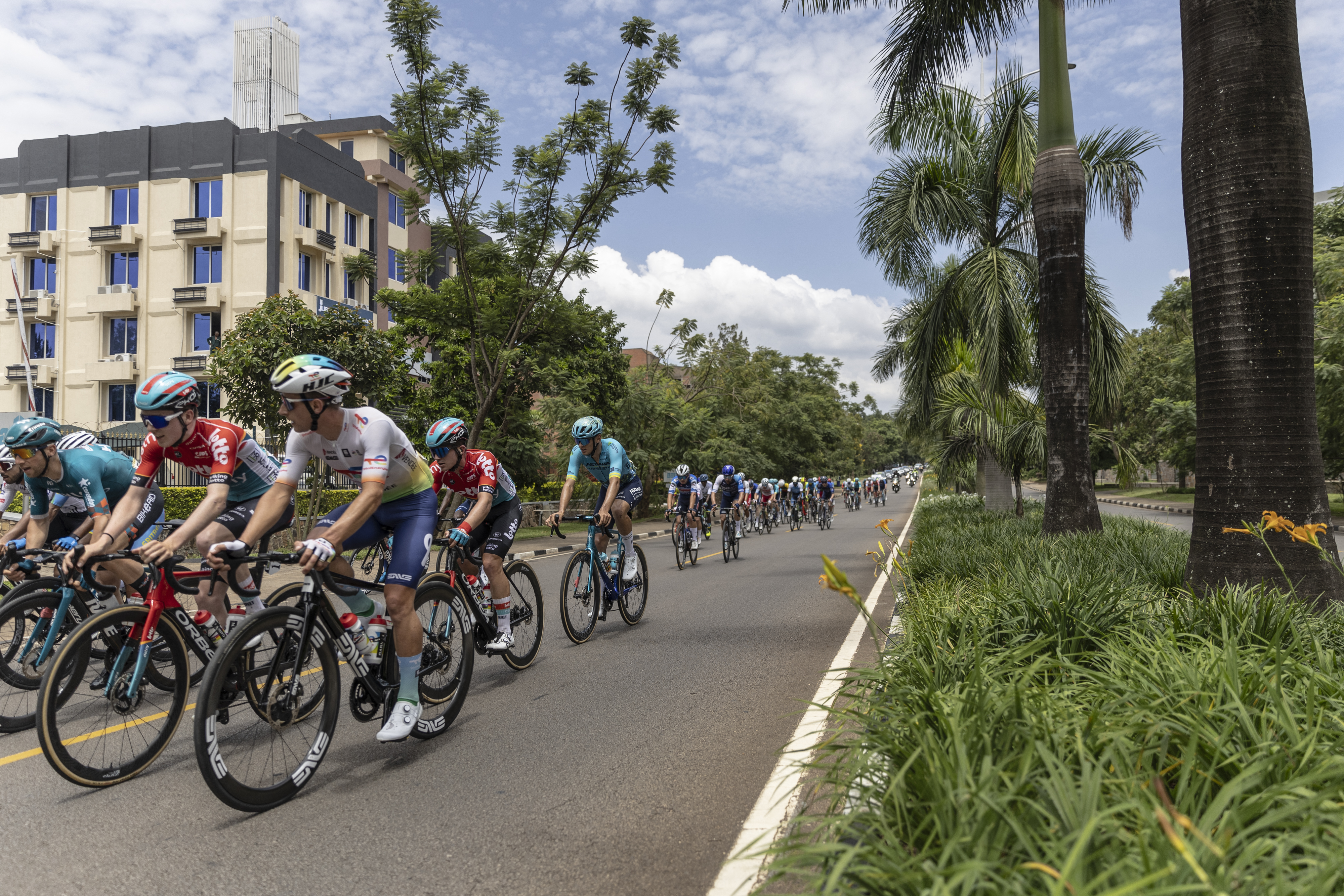 The pack rides during the last stage of the 16th Tour du Rwanda in Kigali on February 25, 2024. (Photo by Guillem Sartorio / AFP)