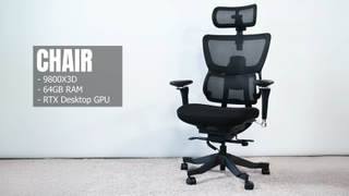 A plain looking, ergonomic office chair concealing a gaming PC underneath the seat.