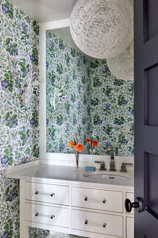Powder room with floral wallpaper