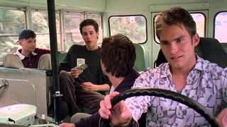 Seann William Scott and a group of boys riding in a bus in 'Road Trip'