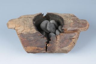 A brazier (incense burner) holding burnt stones that was found in Pamirs.