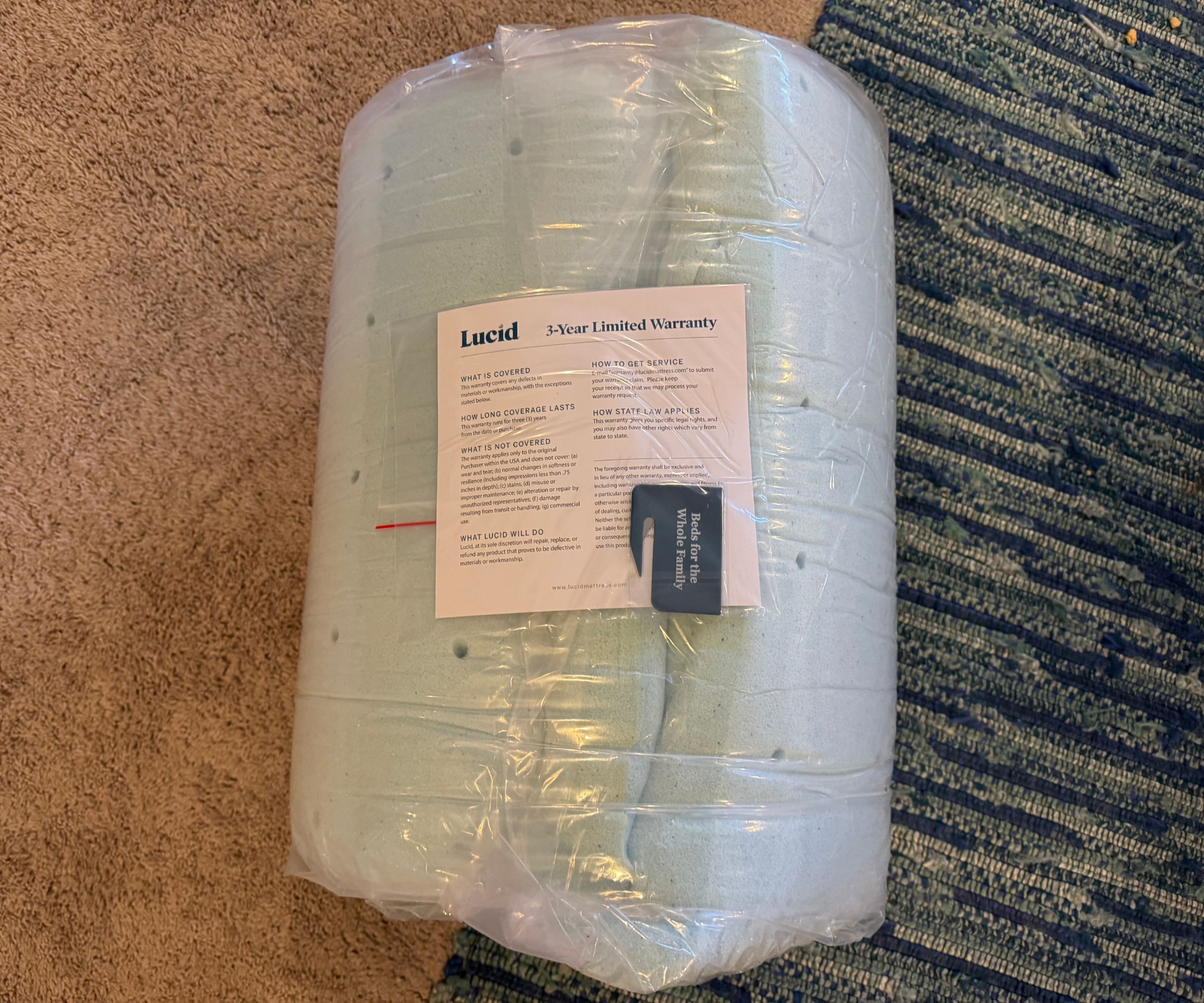 Lucid mattress topper being unboxed and tested for a review