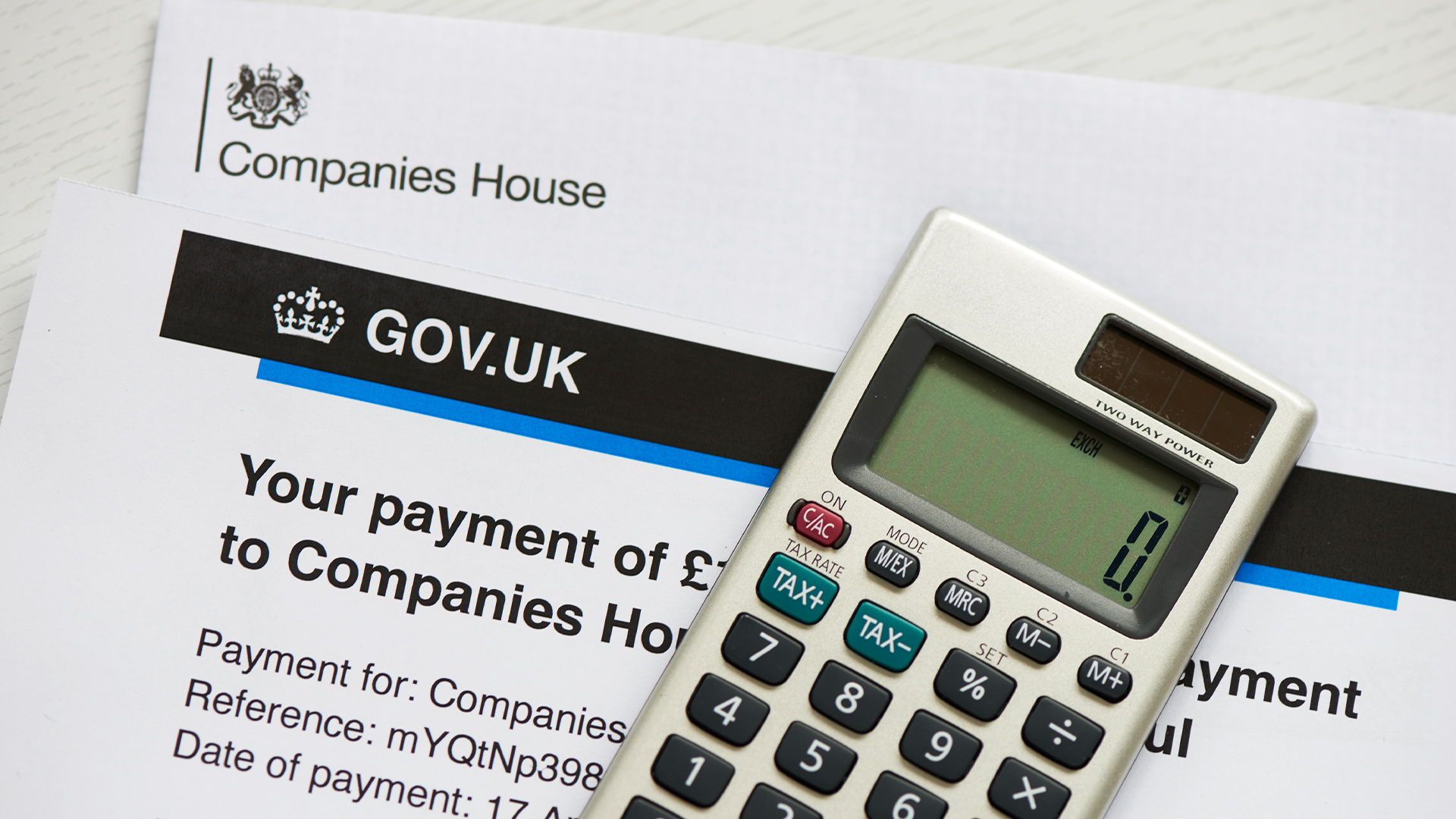 Companies House letter with payment demand and reference number, with Gov.uk branding on letterhead.