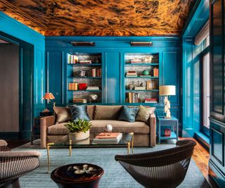 formal living room with teal gloss walls, brown patterned ceiling