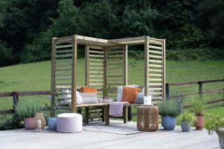 grey patio ares with tall garden furniture pergola