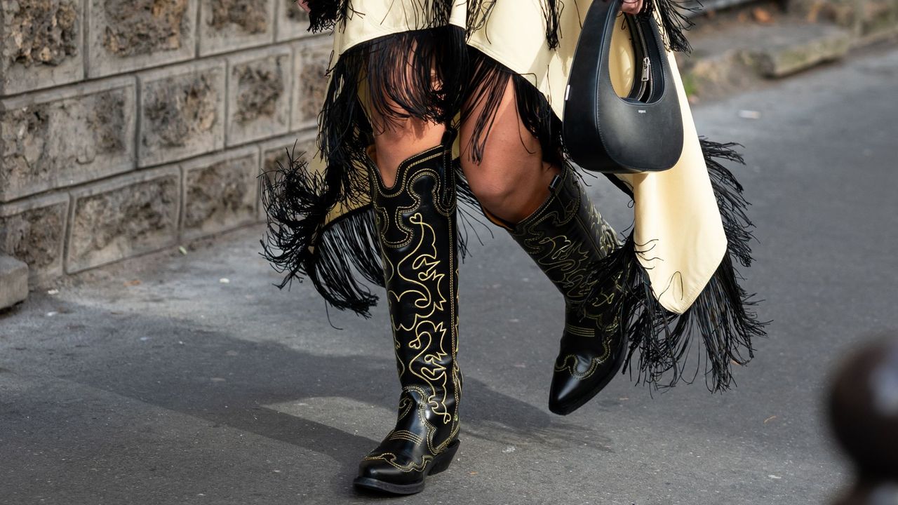 A guest in cowboy boots and tassels