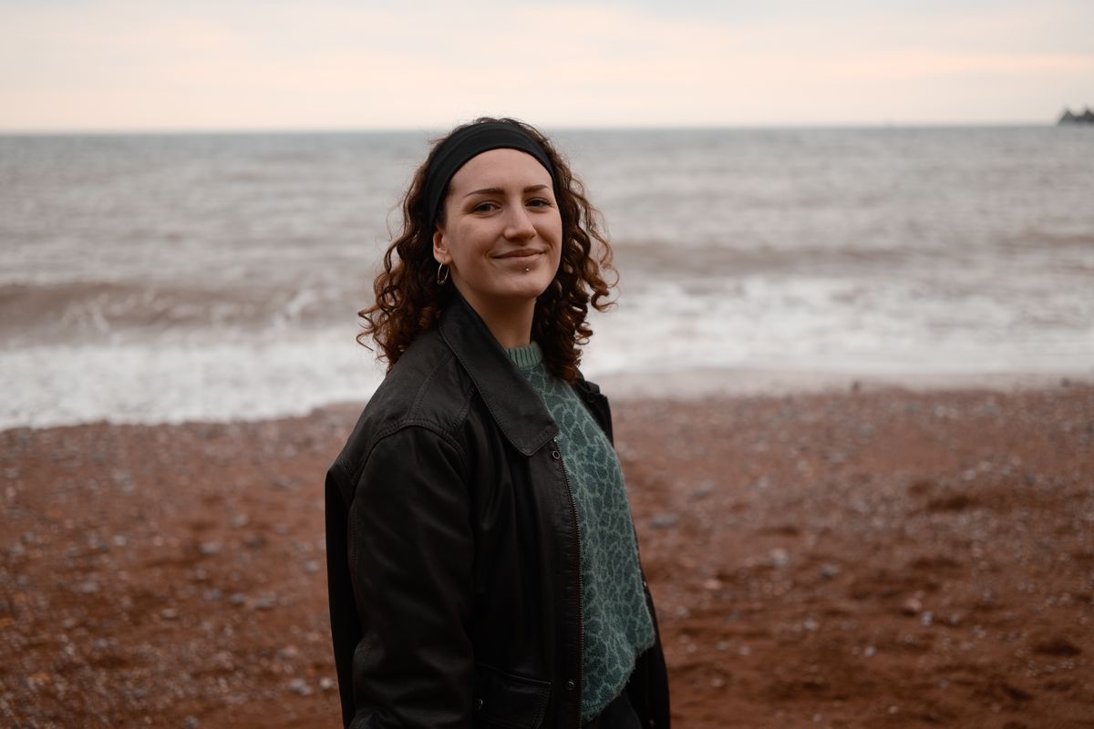 A photo of a woman smiling, taken on a Sigma BF camera