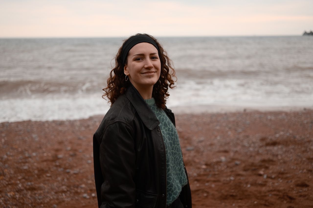 A photo of a woman smiling, taken on a Sigma BF camera
