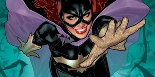A comic book Batgirl reaching at the viewer