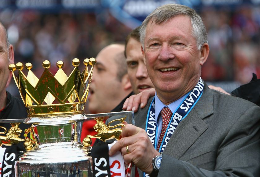 Manchester United manager Alex Ferguson celebrates with the Premier League trophy in May 2009.