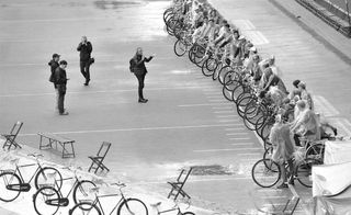 Male standing near multiple bikes