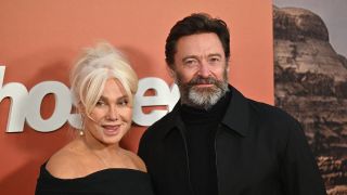 Deborra and Hugh posing on the red carpet at the premiere of Ghosted