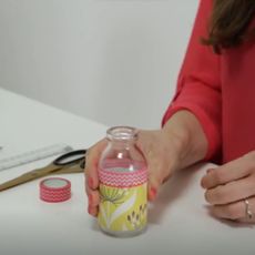 bottle with wrapping paper and scissor