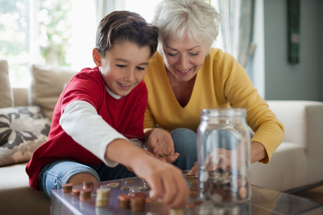 Grandmother and grandson counting coins