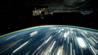 a view of earth with long streaks of light