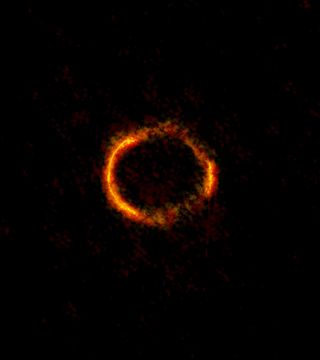 The gravitationally lensed galaxy SDP.81, imaged by ALMA. The bright orange central region of the ring reveals the glowing dust in this distant galaxy. The surrounding, lower-resolution portions of the ring trace the millimeter-wavelength light emitted by carbon monoxide.