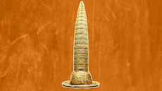a pointy gold hat against an orange background