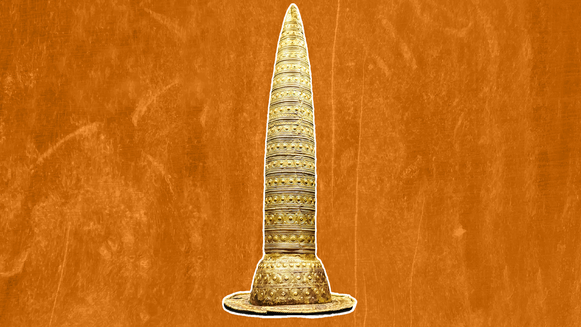 a pointy gold hat against an orange background