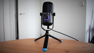 Hero image for best podcasting microphones showing JLab Talk review