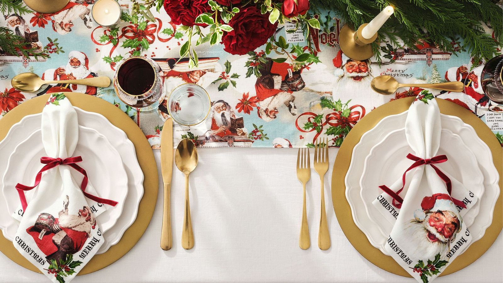 Christmas tablescape with gold flatware and Norman Rockwell prints on napkins and runner