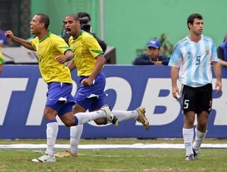 Luis Fabiano and Adriano celebrate a goal for Brazil against Argentina in the 2004 Copa America final as Javier Mascherano looks dejected.