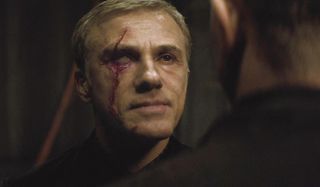 Spectre Blofeld eye injury standing in front of Bond
