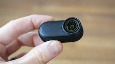 Tiny Insta360 Go 3S camera only in the hand