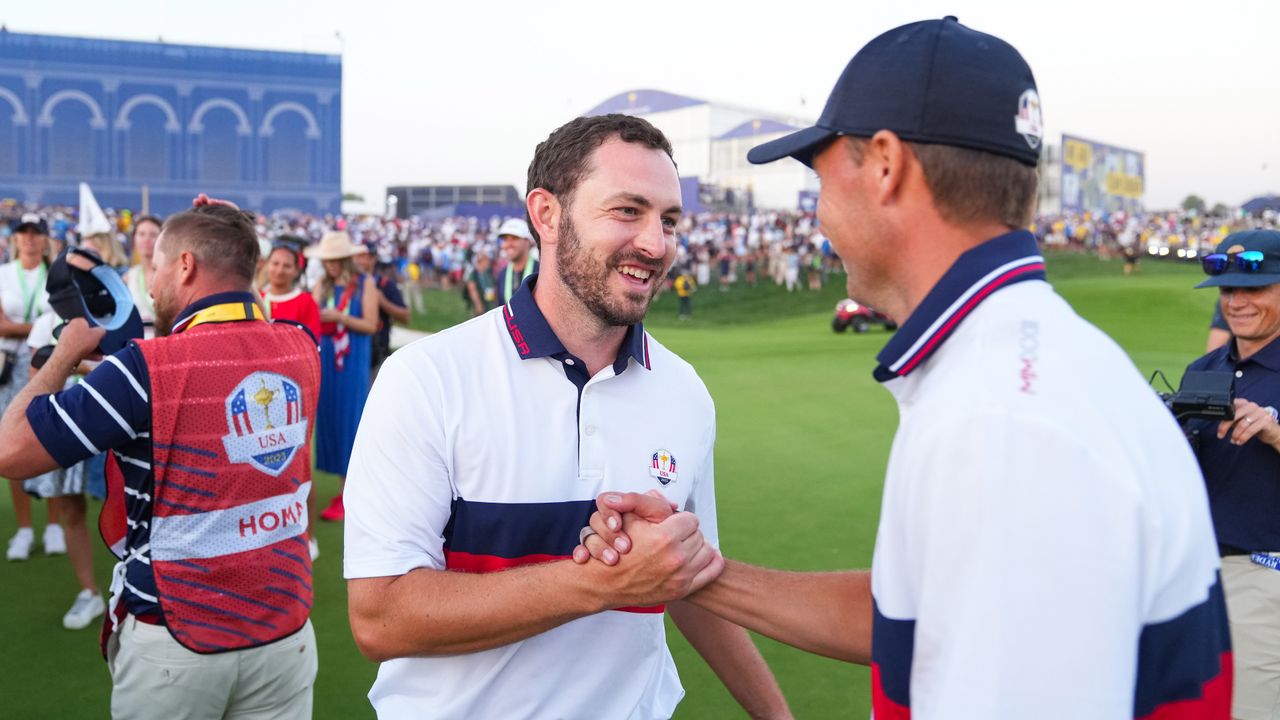 Jordan Spieth of Team United States shakes hands with Patrick Cantlay of Team United States after a match-winning putt on the 18th hole during the Ryder Cup at Marco Simone Golf &amp; Country Club