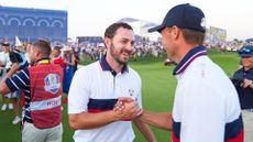 Jordan Spieth of Team United States shakes hands with Patrick Cantlay of Team United States after a match-winning putt on the 18th hole during the Ryder Cup at Marco Simone Golf & Country Club