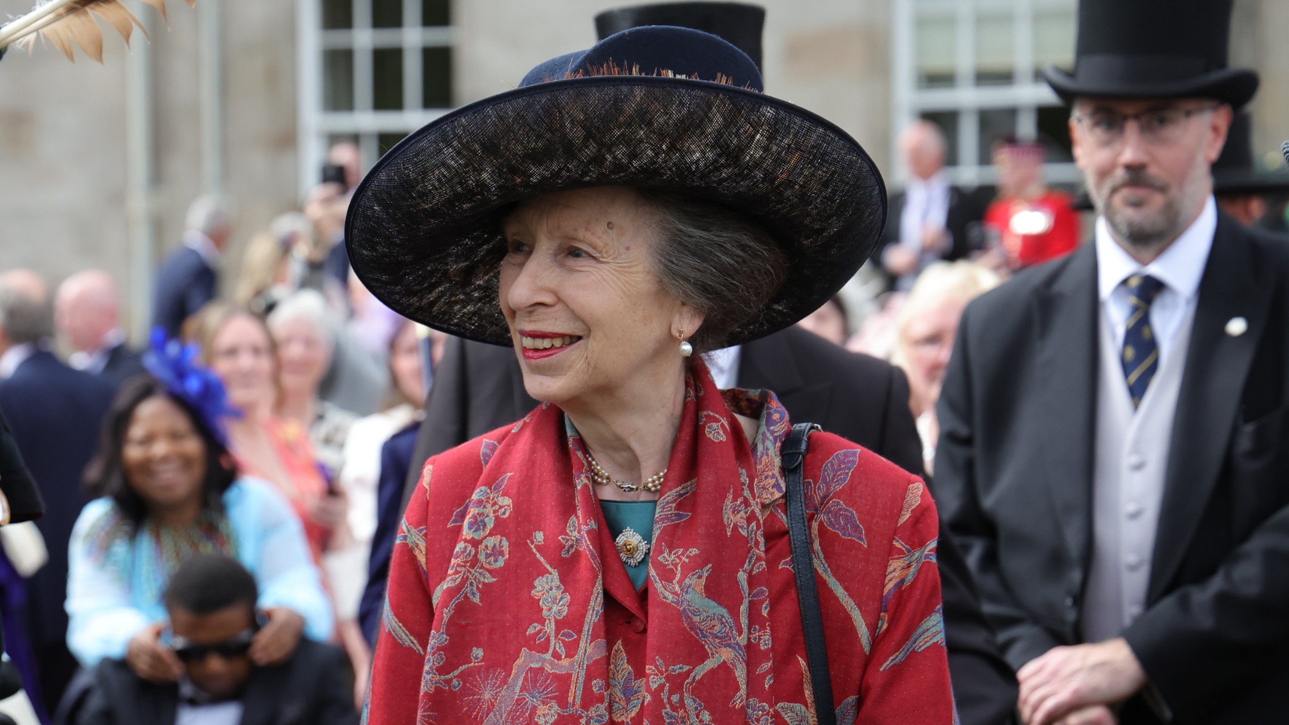 Princess Anne speaks to guests during a Garden Party in the gardens of the Palace of Holyroodhouse on June 30, 2026