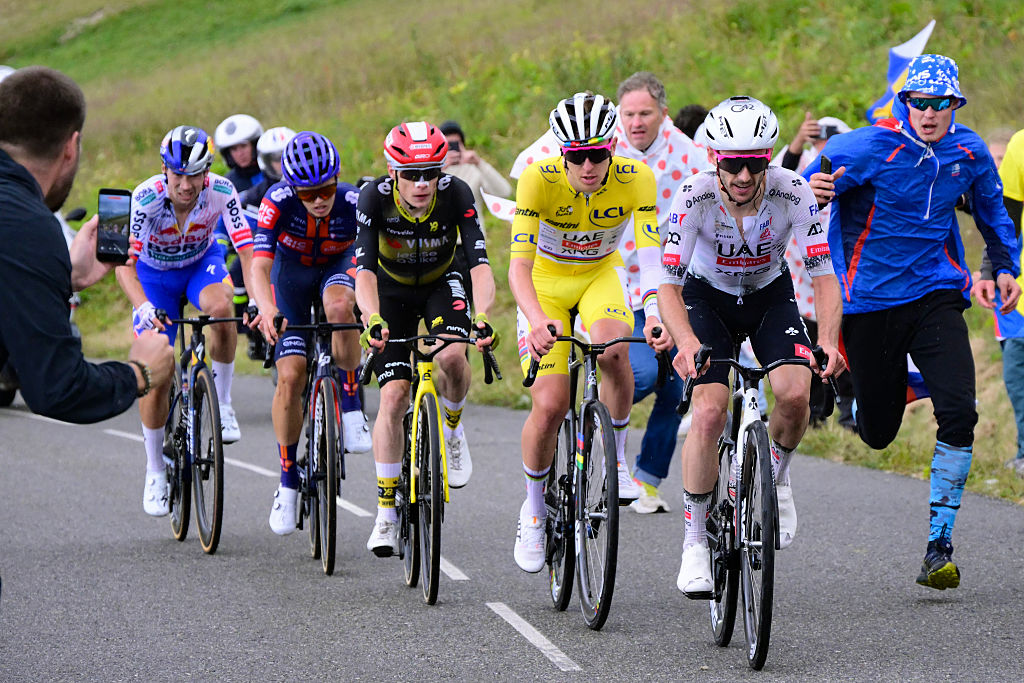 Red Bull - BORA - hansgrohe team's Slovenian rider Primoz Roglic, Team Picnic PostNL team's British rider Oscar Onley, Team Visma - Lease a bike team's Danish rider Jonas Vingegaard, UAE Team Emirates - XRG team's Slovenian rider Tadej Pogacar wearing the overall leader's yellow jersey and UAE Team Emirates - XRG team's British rider Adam Yates cycle in the ascent of Col de la Loze during the 18th stage of the 112th edition of the Tour de France cycling race, 171.5 km between Vif and Courchevel Col de la Loze, in the Alps, southeastern France, on July 24, 2025. (Photo by Bernard PAPON / POOL / AFP)