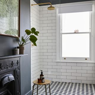 bathroom with shower and white tiles